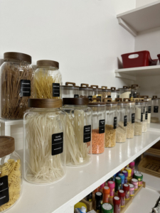 Professional home organizer organizing kitchen